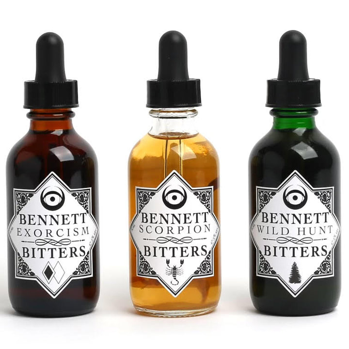 The three bottles in The Esoteric Collection; Exorcism Bitters, Scorpion Bitters, and Wild Hunt Bitters by Bennett Bitters.