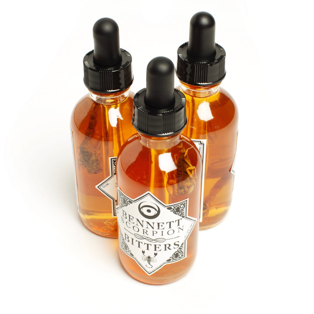 Three bottles of Spicy Scorpion Bitters by Bennett Bitters.